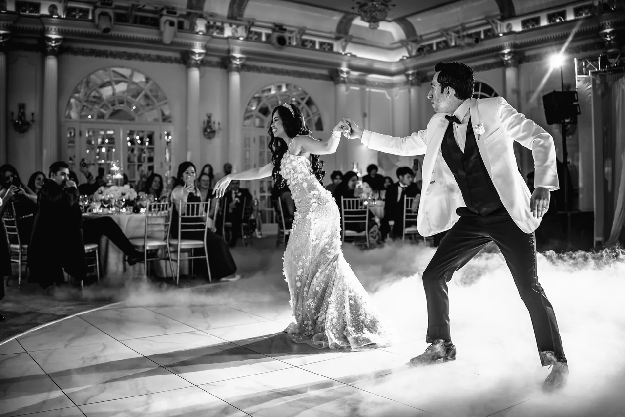 Black and white first dance on a fog-filled dance floor at the Crystal Plaza in Livingston, New Jersey