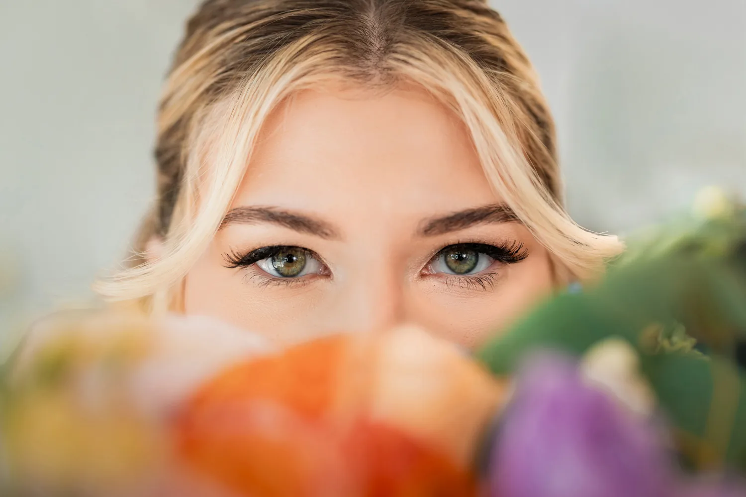 Chelsea&rsquo;s eyes above her bouquet, bridal detail portrait at Larkfield &mdash; George Pompilio Photography