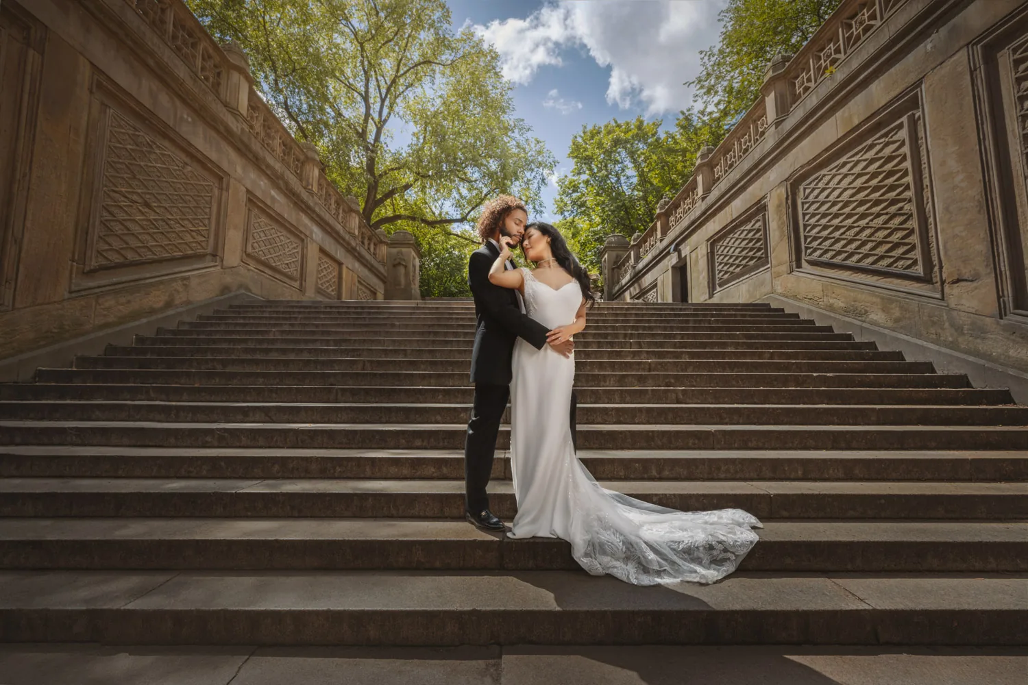 Bride and groom on the grand stairs at Bethesda Terrace in Central Park &mdash; George Pompilio Photography