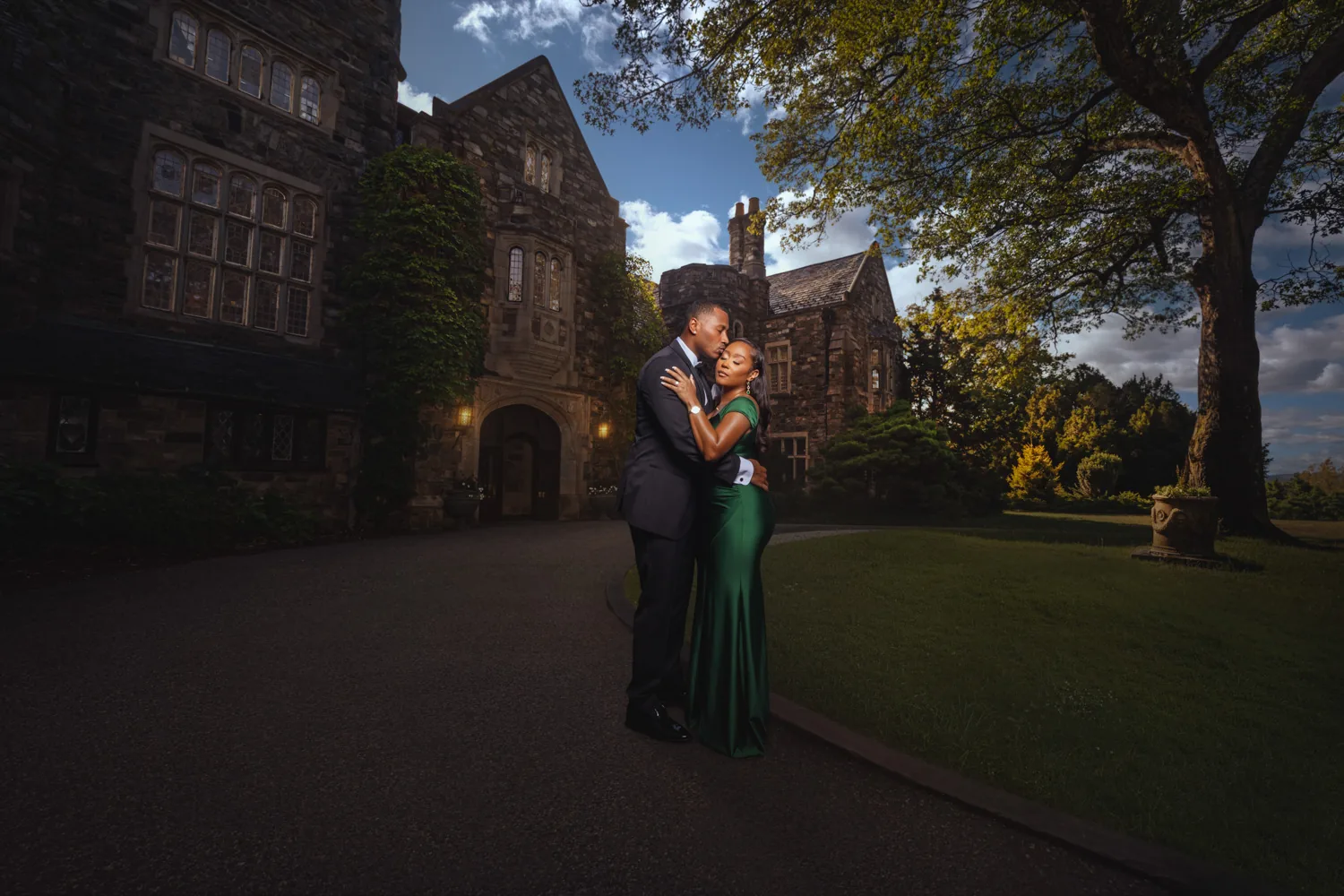 Elegant gown against the stone architecture of Skyland Manor in Ringwood, NJ, engagement session by George Pompilio