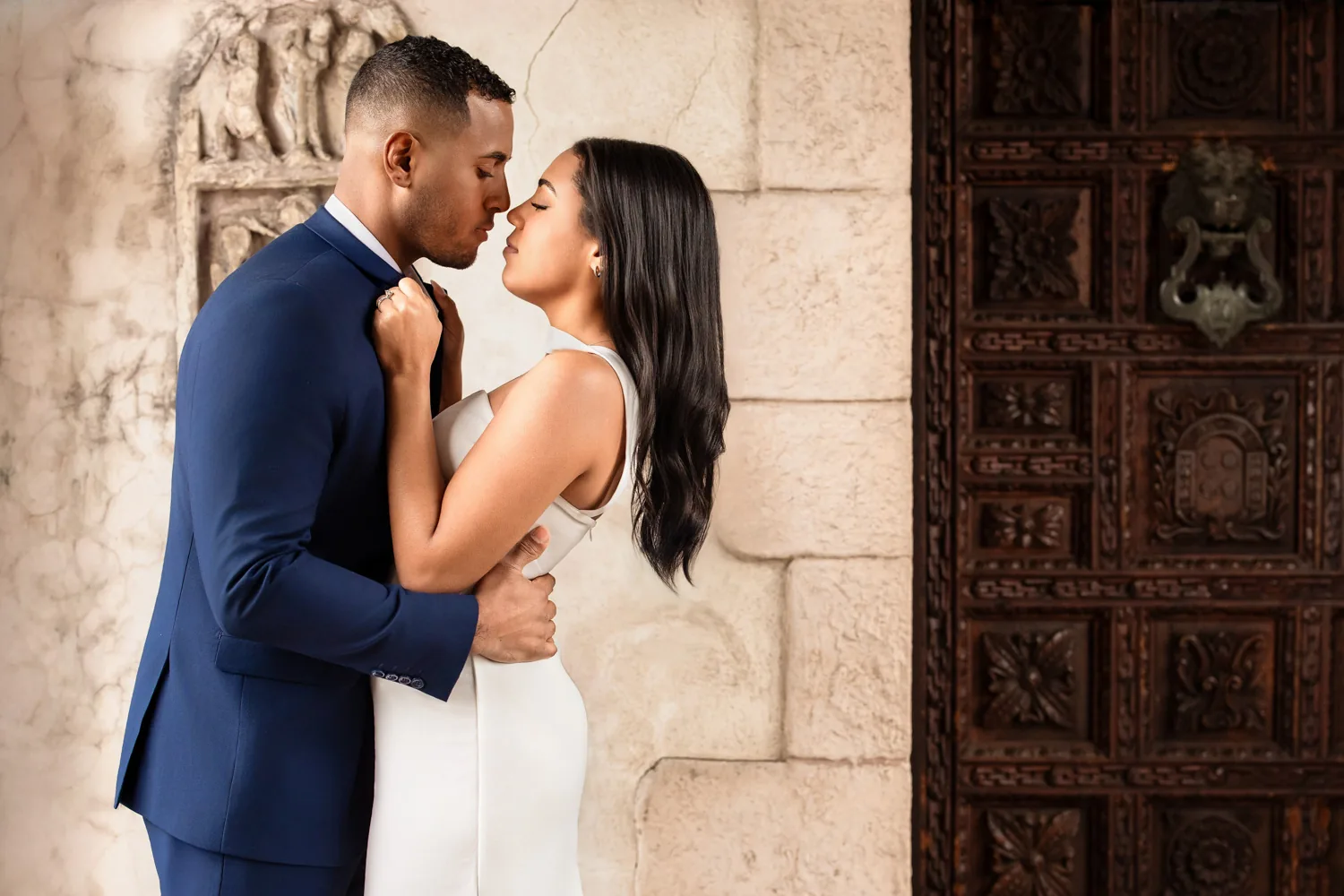 Elegant couple in the courtyard of the Vanderbilt Museum on Long Island, engagement session by George Pompilio