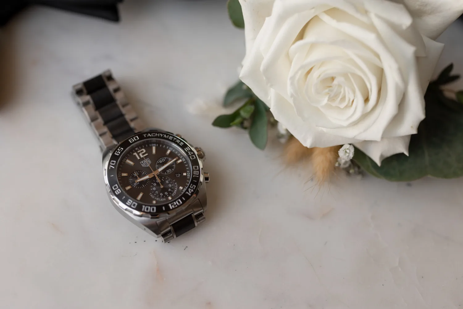 Luke&rsquo;s watch and white rose boutonniere, groom details on Allison and Luke&rsquo;s wedding day &mdash; George Pompilio Photography