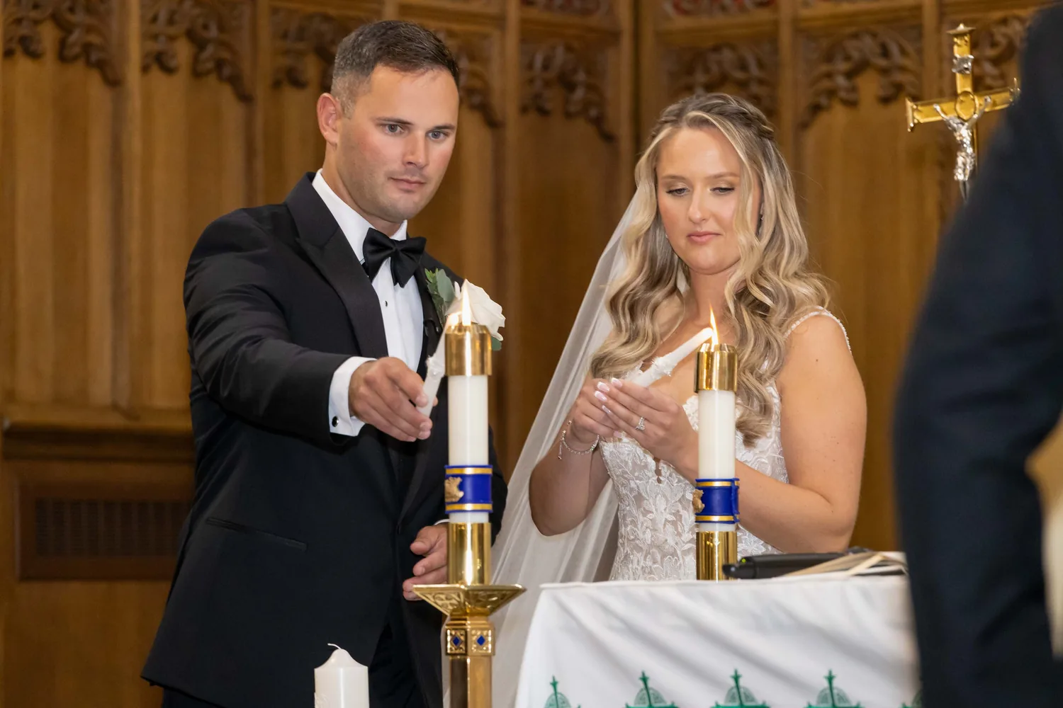 Allison and Luke lighting the unity candle at The Church of St. Christopher &mdash; George Pompilio Photography