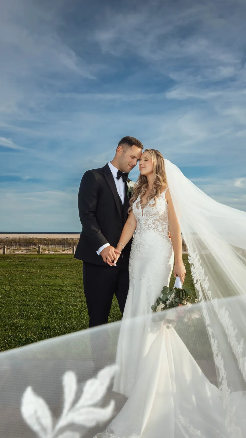 Allison and Luke by the beach at Gatsby on the Ocean