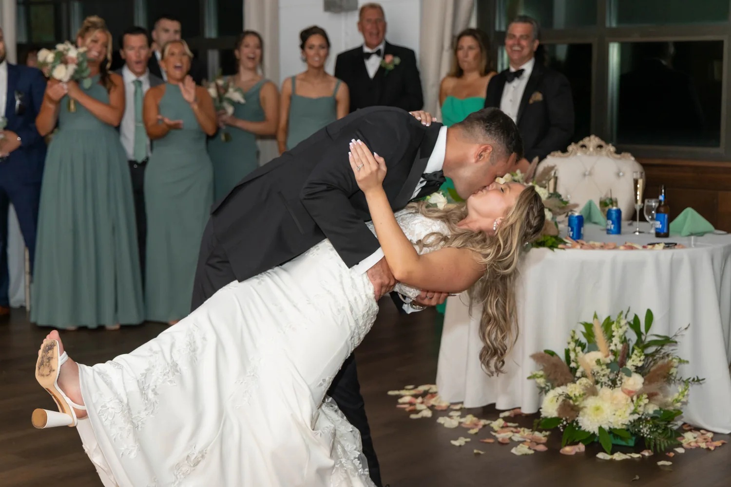 Luke dipping Allison for a kiss by the sweetheart table at Gatsby On The Ocean &mdash; George Pompilio Photography