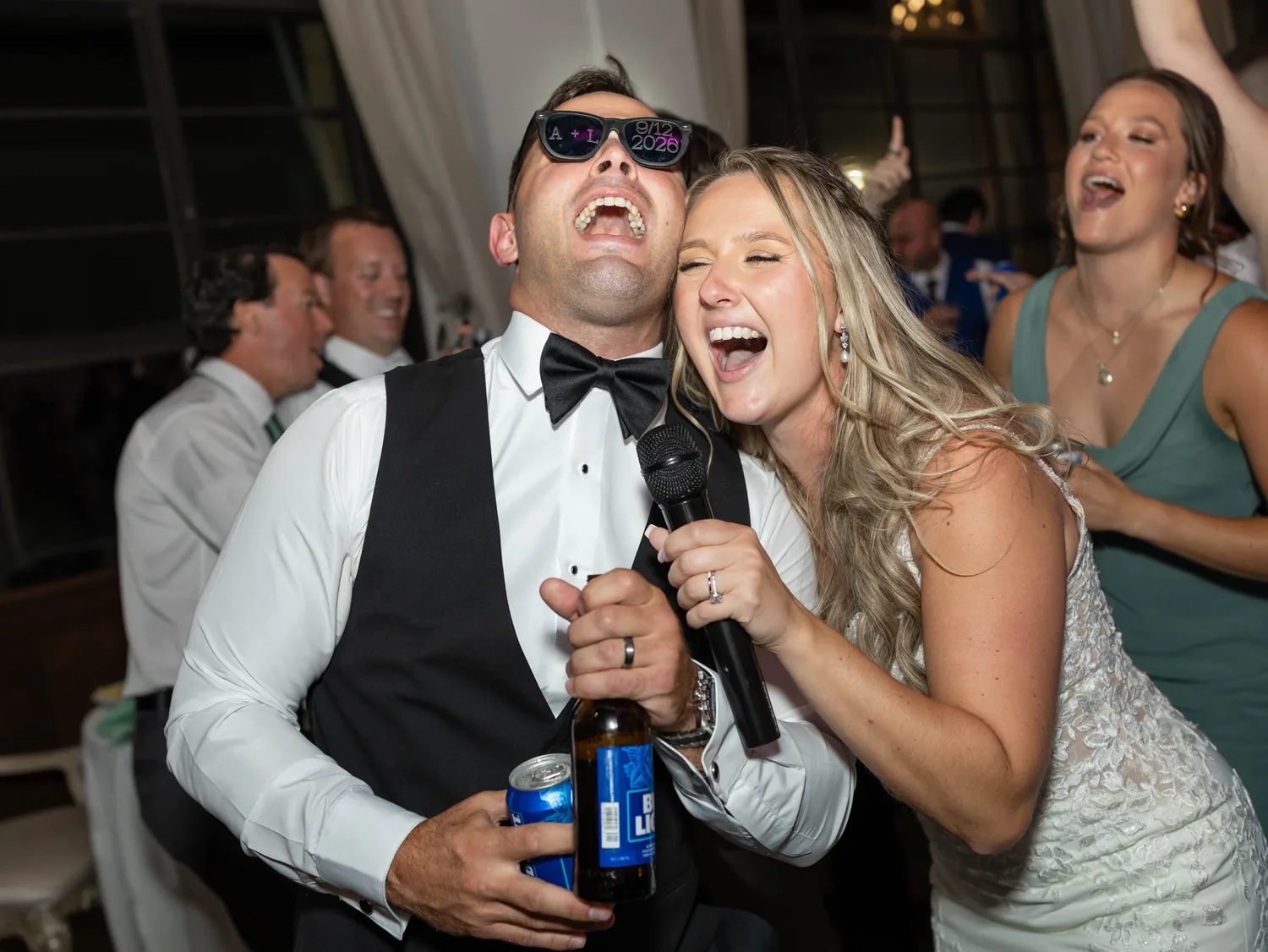 Allison and Luke singing into a microphone together on the dance floor at Gatsby On The Ocean &mdash; George Pompilio Photography