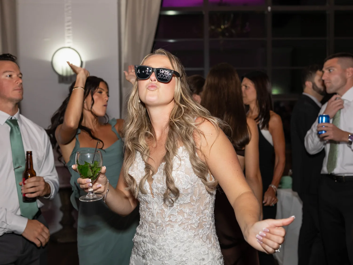 Allison dancing in party sunglasses with guests at her Gatsby On The Ocean reception &mdash; George Pompilio Photography