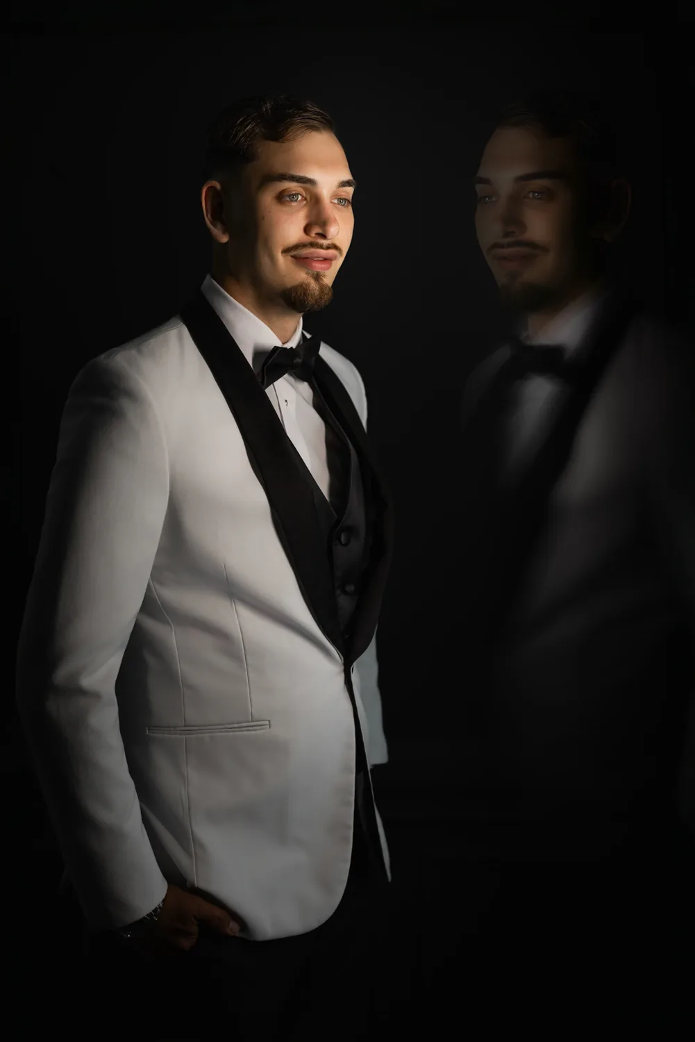 Chelsea and Ryan&rsquo;s wedding: Groom portrait with reflection in dramatic low light, Larkfield wedding &mdash; George Pompilio Photography