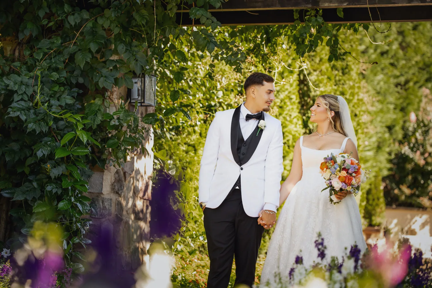 Chelsea and Ryan&rsquo;s wedding: Bride and groom portrait framed by greenery at Larkfield &mdash; George Pompilio Photography