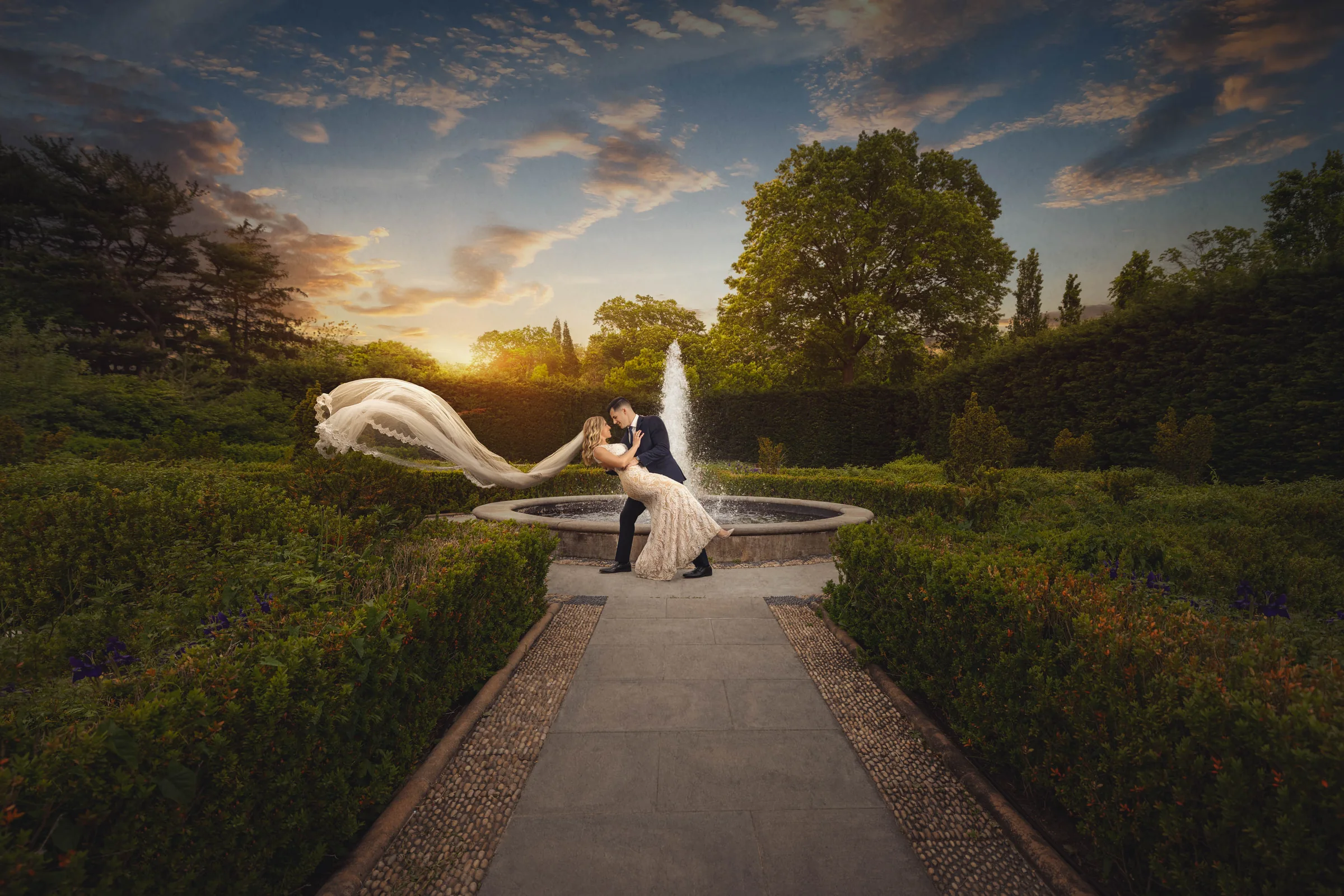 Bride and groom dip kiss at Snug Harbor Tuscan Garden — George Pompilio Photography