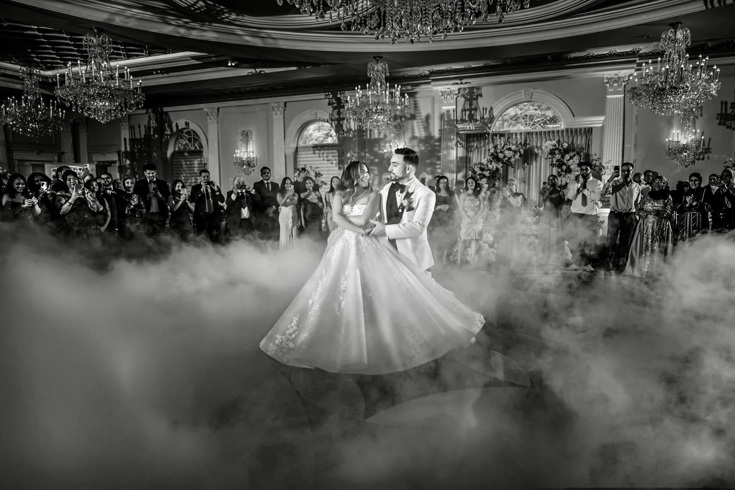 Black and white first dance through low fog under the chandeliers at The Rockleigh, New Jersey &mdash; George Pompilio Photography