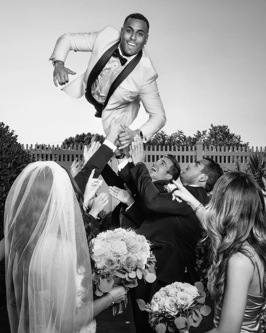 Groom tossed into the air by his groomsmen at Watermill Caterers &mdash; George Pompilio Photography